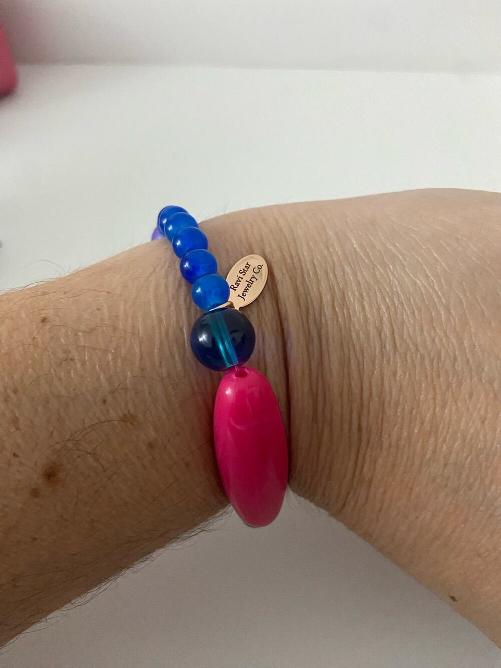 Handmade bright blue and pink bead bracelet